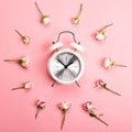 Retro white and silver alarm clock on a pink background Royalty Free Stock Photo