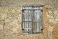 Retro window with wooden shutters and traditional clay wall. Royalty Free Stock Photo