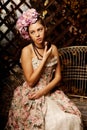 Retro woman. Girl in vintage style with flowers in the hairstyle Royalty Free Stock Photo