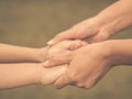 Retro woman holds the hand of a lovely child. Royalty Free Stock Photo