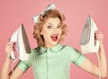 Retro woman ironing clothes, housework. Housekeeper in uniform with iron, household. Services, wife, gender equality. Royalty Free Stock Photo