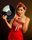 Retro woman music vinyl record. Girl drink bloody mary cocktail. Royalty Free Stock Photo