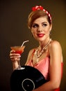 Retro woman with music vinyl record. Pin up girl drink martini cocktail Royalty Free Stock Photo