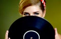 Retro woman with music vinyl record. Pin-up retro female style