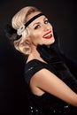 Retro woman portrait. Blonde wavy hairstyle. Hollywood red lips makeup. Curly hair style. Beautiful elegant female wears in Royalty Free Stock Photo