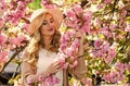 retro woman smell sakura flowers. spa and beauty treatment. soft skin care. healthy girl in cherry tree garden. vintage Royalty Free Stock Photo