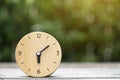 Retro wood clock on wooden table