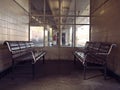 Retro wooden benches at a train station Royalty Free Stock Photo