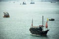 Retro wooden ship or Chinese junk boats in Victoria Harbour in Hong Kong, China