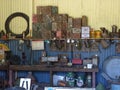 Retro workshop background with rusty vessels and old tools. Corrugated yellow-blue sheet metal wall in the background. Assortment Royalty Free Stock Photo