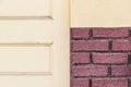 Retro yellow door red brick wall background texture Royalty Free Stock Photo