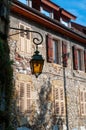 Retro yellow lantern on old worn wall background, Annecy, France Royalty Free Stock Photo