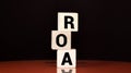 Return on Asset. ROA the word on wooden cubes. Royalty Free Stock Photo