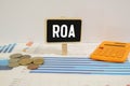 Return On Assets - acronym ROA on wooden blocks on office table Royalty Free Stock Photo