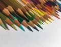 Return back to school. Close up of colored sharpened pencils on white background. Colorful concept Royalty Free Stock Photo