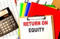RETURN ON EQUITY text written on paper clipboard with chart and calculator