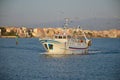 The return of a fishing boat in the port of Anzio Royalty Free Stock Photo