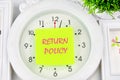 Return Policy written on the yellow sticker on the watch Royalty Free Stock Photo