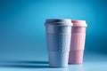 Reusable coffee cup on light blue background. Bamboo cup. Royalty Free Stock Photo