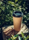 Reusable coffee cup. Outdoor coffee and cookies. Coffee to go