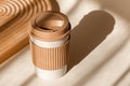 Reusable cup, biodegradable travel plastic coffee mug for take away. Sustainable bamboo eco friendly cup on natural Royalty Free Stock Photo