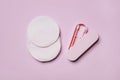 Reusable Double-sided Cotton Swab Ear Pick Stick in a box and Bamboo Make Up Remover Pads on pink background. Royalty Free Stock Photo