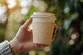 Reusable Eco-Friendly Coffee Cup Held Outdoors Royalty Free Stock Photo