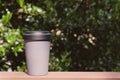 Reusable eco-friendly grey bamboo cup with lid. Royalty Free Stock Photo