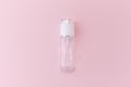 Reusable glass white bottle for oil, cream, lotion or serum on a pink background. Zero waste, eco-friendly Royalty Free Stock Photo