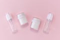 Reusable glass white bottles for oil, cream, lotion or serum on a pink background. Zero waste, eco-friendly Royalty Free Stock Photo