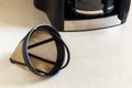 Reusable metal mesh coffee filter for drip coffee maker. Permanent basket coffee filter on white background