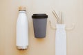 Reusable plastic free and eco friendly utensils. Metal drinking straws, bamboo cup and water bottle.