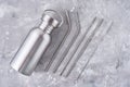 Reusable plastic free items on a gray background. Top view of aluminun bottle and metal tubes. Zero waste eco friendly concept Royalty Free Stock Photo