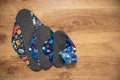 Reusable sanitary menstrual pads on a medium wooden background