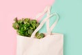 Reusable shopping bag full of groceries on color background Royalty Free Stock Photo