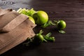 Reusable shopping jute bag with fresh fruits and greens on wooden background Royalty Free Stock Photo