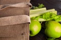 Reusable shopping jute bag with fresh fruits and greens on wooden background Royalty Free Stock Photo