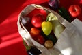 Reusable shopping textile bag full of groceries, fresh fruits and vegetables purchased from the store on red background Royalty Free Stock Photo