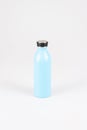 Reusable stylish eco friendly sustainable blue water bottle on light grey background