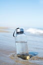 Reusable water bottle on the beach