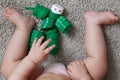 reuse of materials. A child plays a robot toy made of plastic pet bottle caps