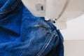 Reuse, repair, upcycle. Denim upcycling ideas, repair and using old jeans. Close-up of sewing machine with shabby, old Royalty Free Stock Photo