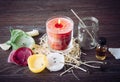 Reusing old candles leftovers and making melting a new one: various ingredients on table: candle wicks, glass jar, old candles wax