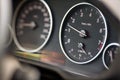 Rev counter of car selective focus closeup with copyspace. Tachometer or revolution counter, RPM gauge with red glowing Royalty Free Stock Photo