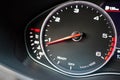 Rev counter of car selective focus closeup with copyspace.Tachometer or revolution counter, RPM gauge with red glowing Royalty Free Stock Photo