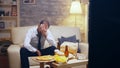 Revealing shot of businessman in suit watching a game