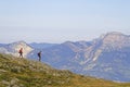 A couple of hikers walks on the slopes of Belledonne