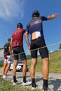 Three spectators and advertsing caravan on the Tour de France Royalty Free Stock Photo