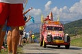 Spectators and advertsing caravan on the Tour de France roads Royalty Free Stock Photo