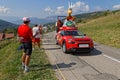 Red car of advertsing caravan on the Tour de France roads Royalty Free Stock Photo